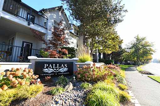 the sign in front of the Pallas Apartments and Townhomes