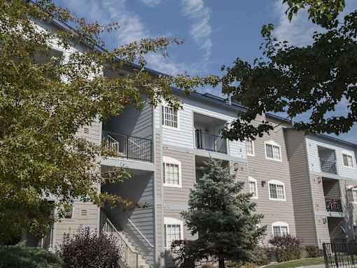 Building exterior with foliage at Marina Village Apartments, Sparks 89434