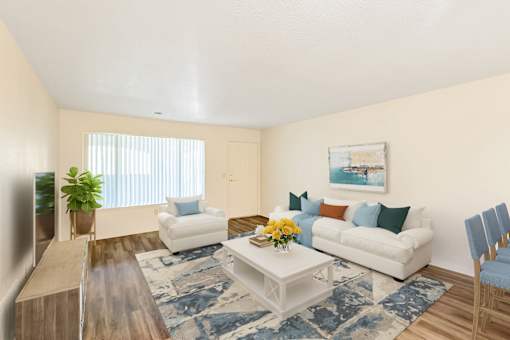 a living room with a white couch and a coffee table