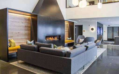 a living room with a couch and a fireplace