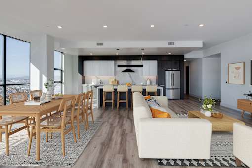 a living and dining room area with a table and chairs
