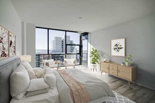 a bedroom with a large bed and a large window