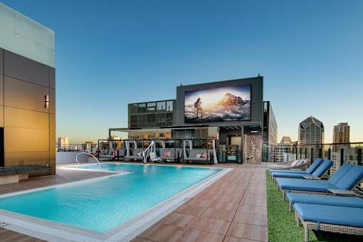 rooftop resort style pool with TV at Luma