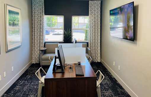 an office with a desk and two chairs