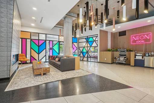 a lobby with a couch and a coffee table