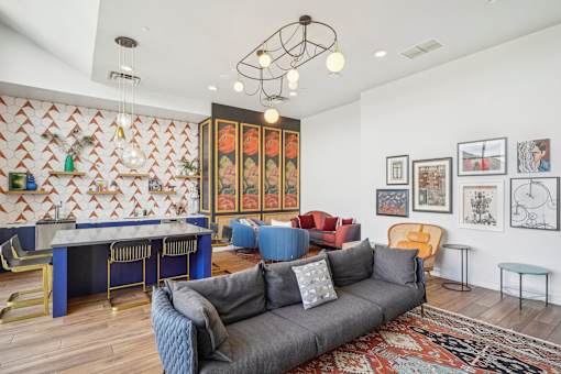 a living room with a couch and a pool table