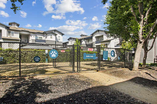 A dog park with a fence and a sign that says "Back Park".