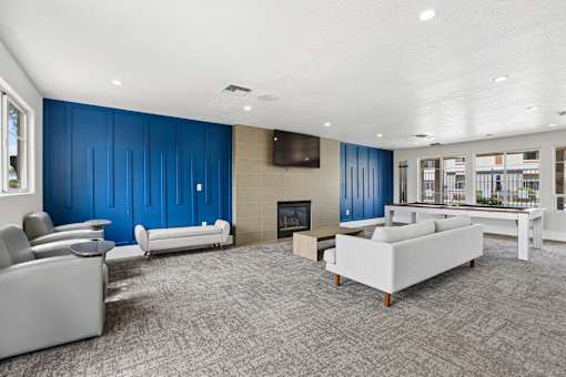 A living room with a fireplace and a white couch.