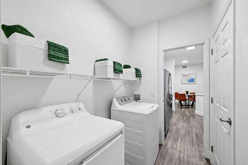 A white bathroom with a white tub and toilet.