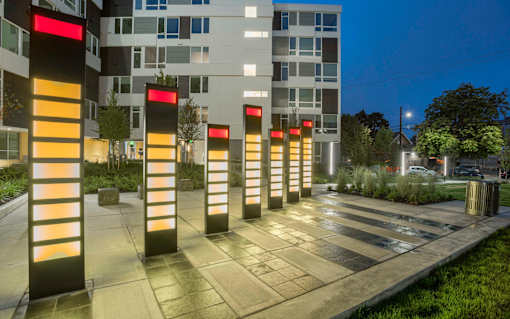 illuminated columns in front of Twenty20 Mad Apartments