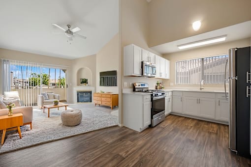 a spacious living room with a kitchen and a living room
