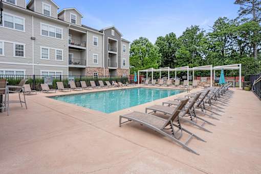 Swimming pool with sun loungers