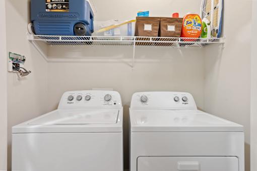 Laundry room with full sized washer and dryer.