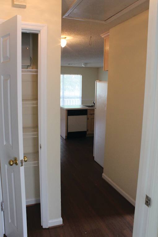 a view of a kitchen from the living room