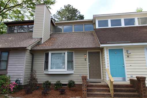 the front of a house with a blue door