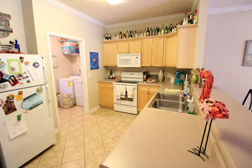 a kitchen with a counter top and a refrigerator