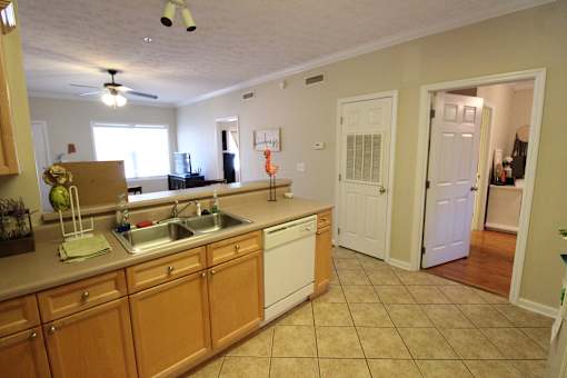 a view of a kitchen with a sink and a counter top