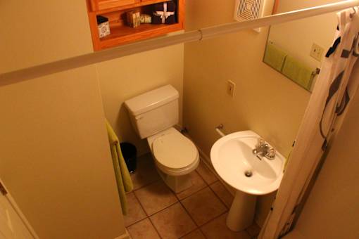 A small bathroom with a toilet and a sink.