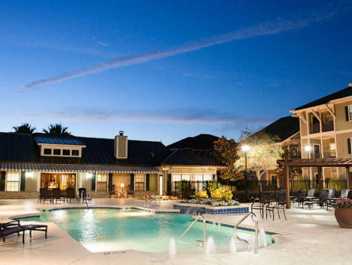 A large house with a pool in the backyard.