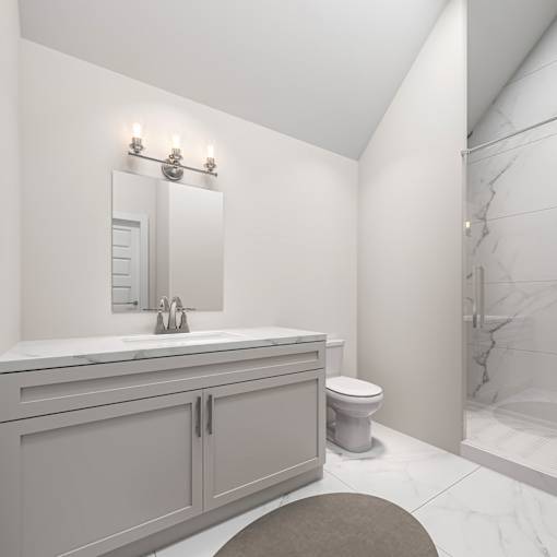 A bathroom with a toilet, sink, and mirror.
