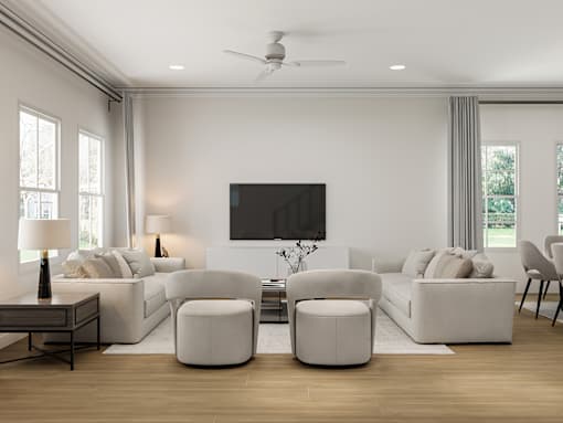 A modern living room with a television, white furniture, and a wooden floor.