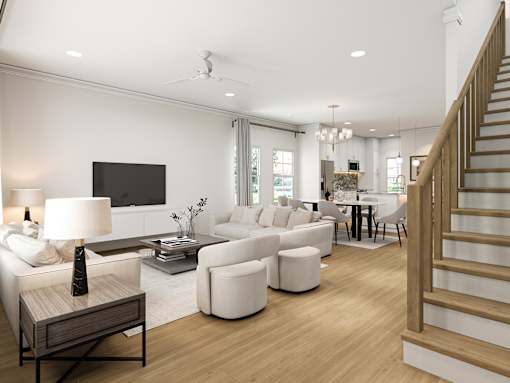 A living room with a staircase on the right side.