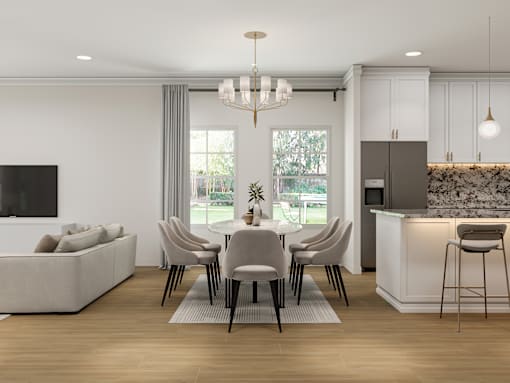 A modern living room with a grey sofa, a dining table with chairs, and a kitchen area with a countertop and cabinets.