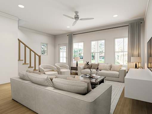 A modern living room with a large sectional sofa and a coffee table.