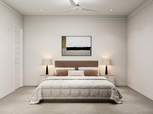 A bedroom with a large bed and two lamps.