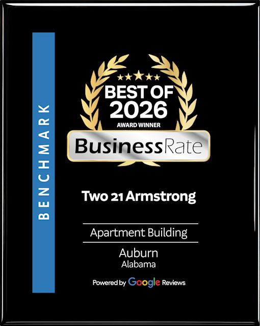 A black and gold award for the best apartment building in 2026.