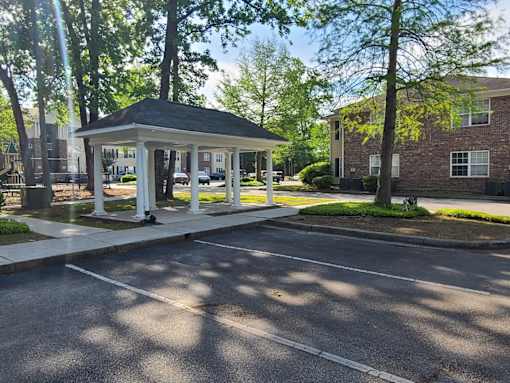 a gazebo in the middle of a parking lot