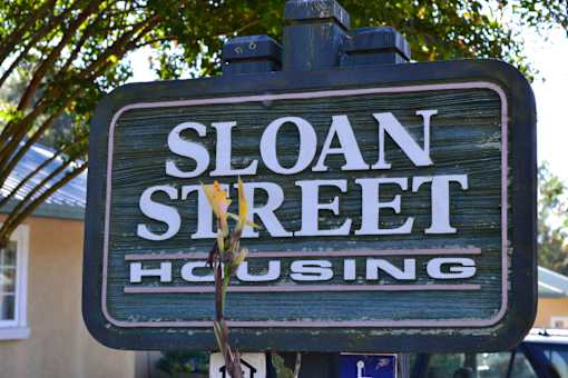 A sign that says Sloan Street Housing.