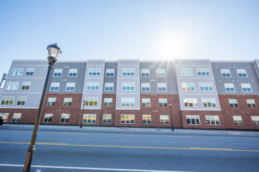 a building with the sun shining in front of it
