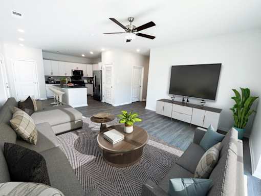 A living room with a grey couch and a coffee table.