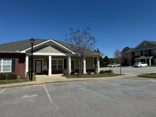 a building with a parking lot in front of it