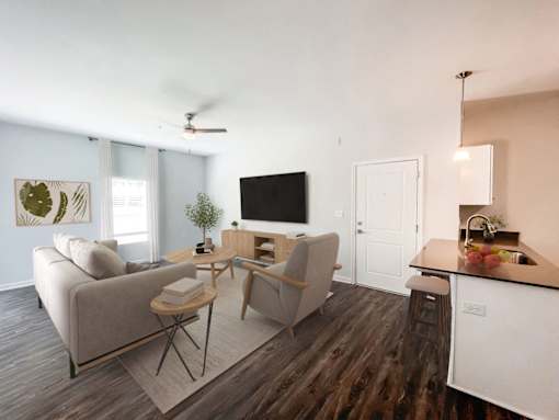 Apartments Near Furman University in Taylors, SC - Northbrook - Living Room with Vinyl Flooring, Large Windows, and a Ceiling Fan