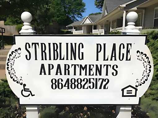 A sign for Stribling Place Apartments with a phone number on it.