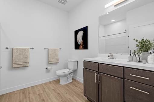 Bathroom with a toilet and sink at 36N Apartments, Tulsa, OK, 74106