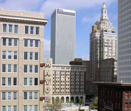 A cityscape with a building named Mayo in the foreground.