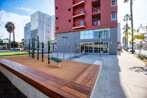 a communal area with benches in front of a building