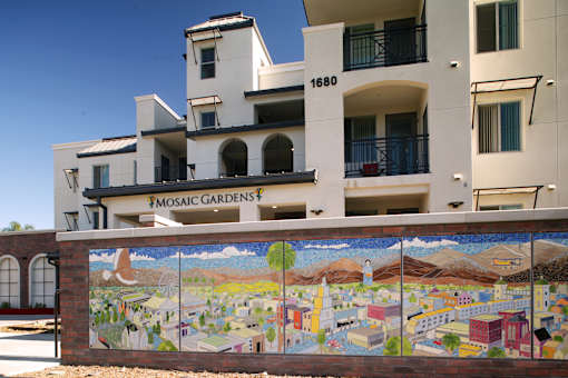 a mural on a wall in front of a building