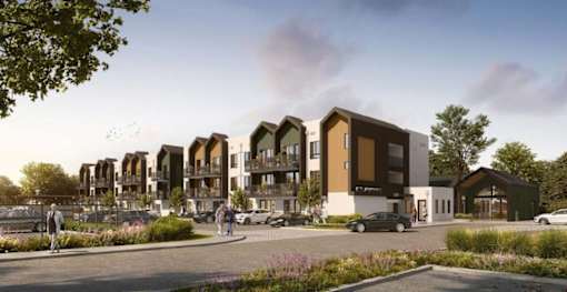 A modern apartment complex with people walking around the entrance.