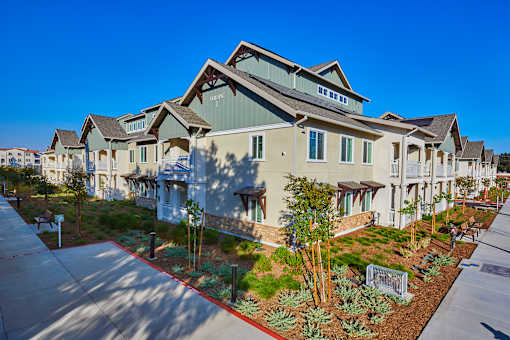 A row of houses with the name "REALTY" on the front.