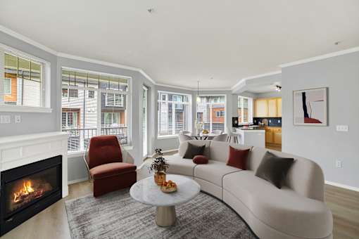 A modern living room with a fireplace and a couch.
