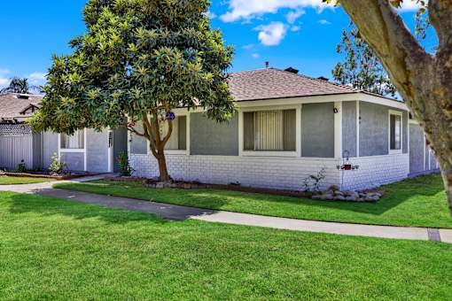 Corner residential building with landscaped front yard at Coventry Square Apartments, California, 97186
