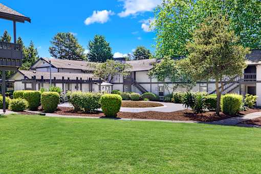 A large building with a lawn in front of it.