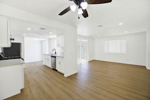 Open concept kitchen and living space with modern finishes at Coventry Square Apartments, California