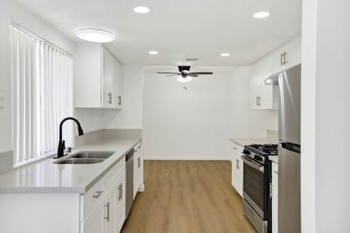 Bright galley kitchen with modern finishes at Coventry Square Apartments, Upland