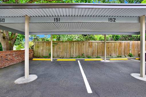 A parking lot with numbered parking spaces 150 to 152.