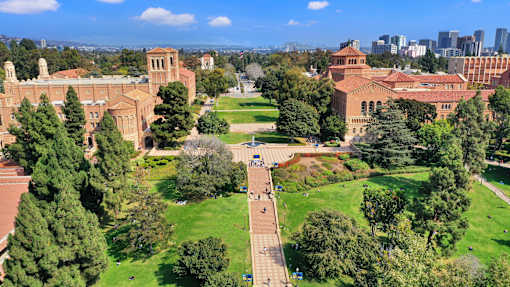 A large building with a green lawn in front of it.at Federal Apartments, Los Angeles, 90025